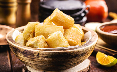 large portion of fried cassava, in a rustic rural setting, typical food from the state of minas Gerais, brazil, brazilian restaurant food