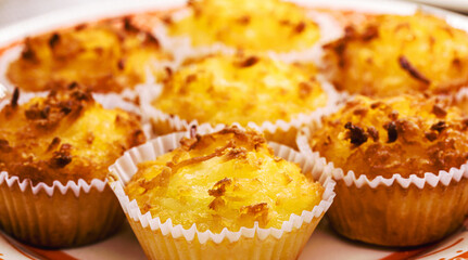 Queijadinha or queijada, sweet baked dessert from a traditional bakery and pastry shop from Brazil and Portugal, made with eggs, and lots of sugar.