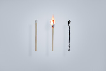 The matchstick in the middle is burning.