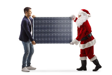 Profile shot of young man and santa claus carrying a solar panel
