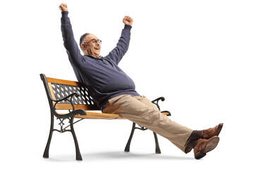 Mature man sitting on a bench and gesturing happiness