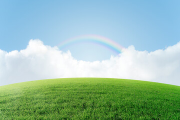 Sky background with green hills and rainbow.