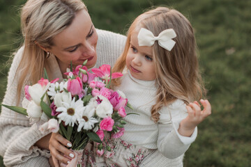 mother and daughter with flower