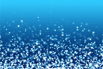 Water blue white glitter particles with abstract blurred light as decoration and background