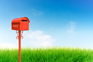 Red mailbox and blue sky.