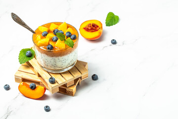 Peach smoothie dessert mousse yogurt with peaches blueberry chia. Eating healthy, vitamin rich Breakfast