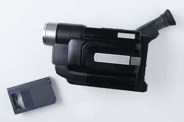 Analog camcorder standard VHS and video cassette. White background. View from above.