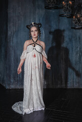 Naklejka premium Beautiful demon style woman with blood on her hands