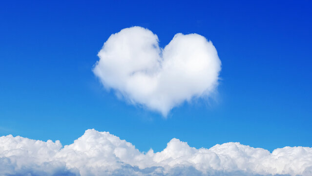 clouds on blue sky with heart shaped cloud. horizontal frame