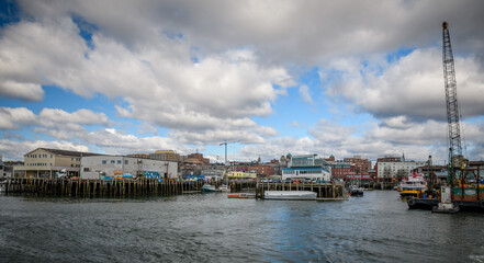 Fototapeta na wymiar Portland, Maine ME waterfront. Boats with sunshine in the back