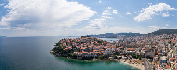 Fototapeta na wymiar Panoramic aerial view of the city of Kavala, Greece. Ottoman aqueduct in the city centre.