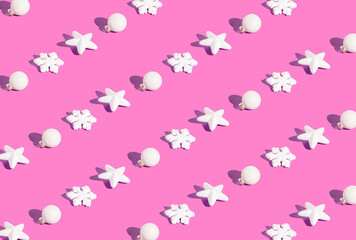 New Year and Christmas ornaments isolated on pink background. Holiday pattern