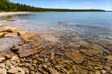 Rocks line the Lake Michigan Shoreline near the beach of Newport State Park, Wisconsin
