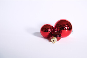 red christmas baubles on white ground