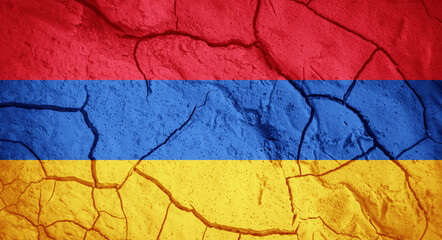 Flag of Armenia. Armenian symbol. Flag on the background of dry cracked earth. Armenian flag with drought concept