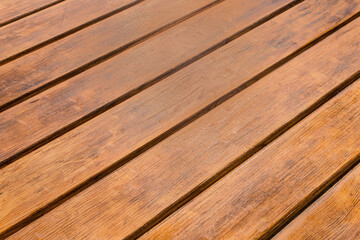 Diagonal texture brown wooden table surface boards wood striped plank lines background
