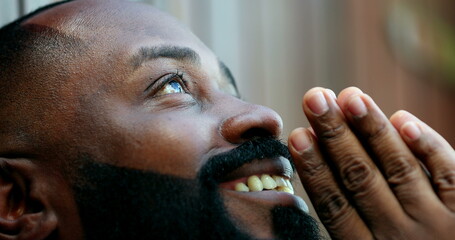 African man opening eyes awakening to a new day