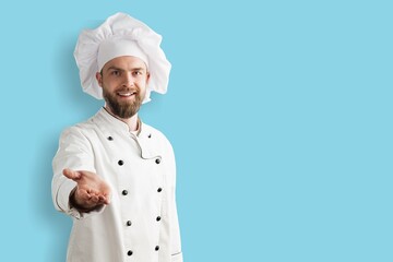 Smiling young Chef in Cooking Uniform