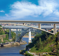 Ponte do Infante, Maria Pia Bridge and St John's Bridge over Douro river in Porto, Portugal. People are unrecognizable.