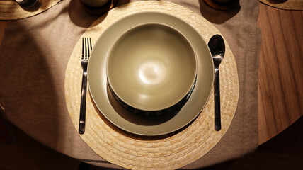 Dinning table set at home, tableware, glasses, spoon and fork.