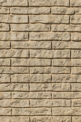 Modern clay vertical brick facade wall texture, sand interior stone beige exterior background