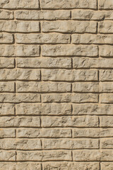 Modern clay vertical brick facade wall texture, sand interior stone beige exterior background