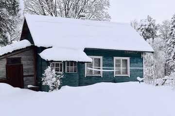 Naklejka premium Winter house in the snow