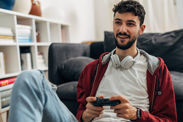 Young man uses his free time to play video games