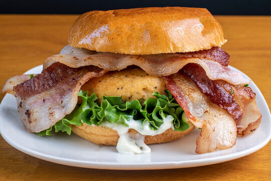 salmon baco burger on a brioche roll