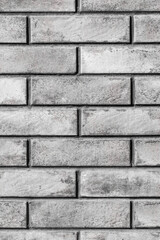 Modern gray abstract brick vertical wall urban facade interior texture grey pattern background