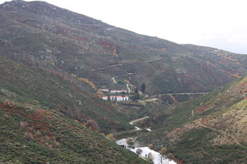 Fototapeta na wymiar View from the top of the mountains of the Serra da Estrela natural park, village of Sabugueiro. Cloudy and rainy day. 
