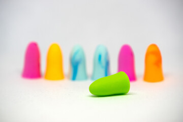 Set of colorful earplugs isolated on white background with space for copytext