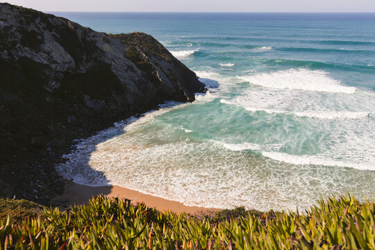 Rugged coastline, beach and the Atlantic Ocean at Praia de Odeceixe; Algarve, Portugal