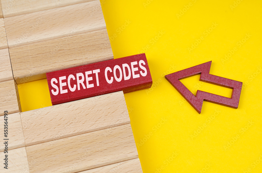 Poster On a yellow surface are wooden blocks and an arrow pointing to a block with the inscription - secret codes