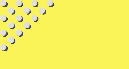 White pills on a yellow background with a hard shadow. Pattern for the background. Medical pharmacy bright design for presentation packaging, website flyer ,cover, business cards. Banner, copyspace