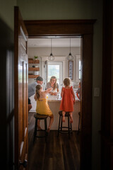 Marine veteran at home with family eating and fixing breakfast.