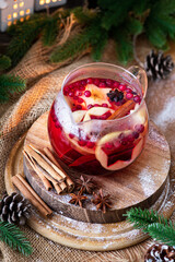 Christmas mulled apple cider with cranberry ,cinnamon and anise.  Traditional winter warming hot drink