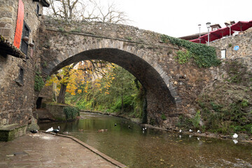view of a bridge over a river in the village of Potes in Cantabria, Spain