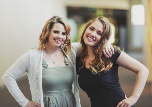 A young woman and her youth leader posing for a picture in a hallway of a church: Edmonton, Alberta, Canada