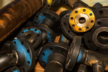 Flanges tack welded to pipes ready to butt weld in a fabrication plant; Innisfail, Alberta, Canada