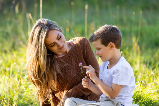 A mother spending quality time with her young son, outdoors in a city park; Edmonton, Alberta, Canada