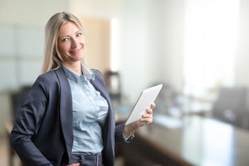 Young woman journalist inoffice with digital tablet