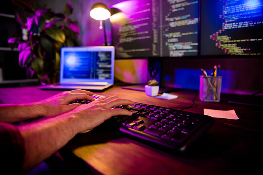 Photo of freelancer arms hands typing creating web start up modern gadget indoors workplace workstation loft