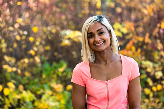 Head and shoulders portrait of a woman outdoors in autumn; Edmonton, Alberta, Canada