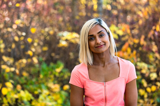 Head and shoulders portrait of a woman outdoors in autumn; Edmonton, Alberta, Canada