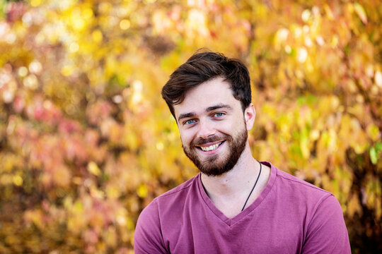 Head and shoulders portrait of a man outdoors in a park in autumn; Edmonton, Alberta, Canada
