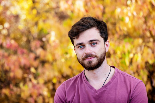 Head and shoulders portrait of a man outdoors in a park in autumn; Edmonton, Alberta, Canada