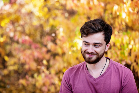 Head and shoulders portrait of a man outdoors in a park in autumn; Edmonton, Alberta, Canada