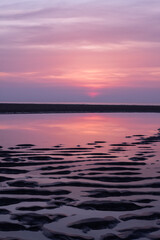 A vivid deep purple and pink los angeles sunset. Beautiful vibrant saturated dreamy sky and colours. Deep pink hues sunset with soft light and clouds.