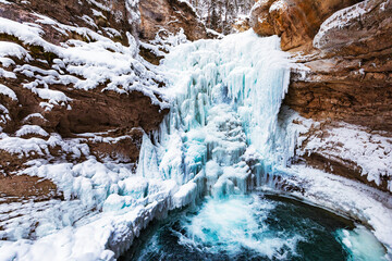 Frozen waterfall and pool at Johnston Canyon during winter in Banff National Park; Alberta, Canada